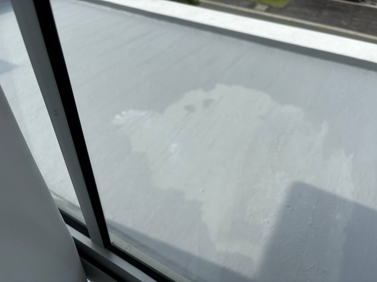 The patched ceiling of my car porch after two kind strangers showed up and fixed the leak I had ignored for months.